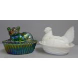 A Westmorland Glass Company iridescent cat on basket and a milk glass hen on basket