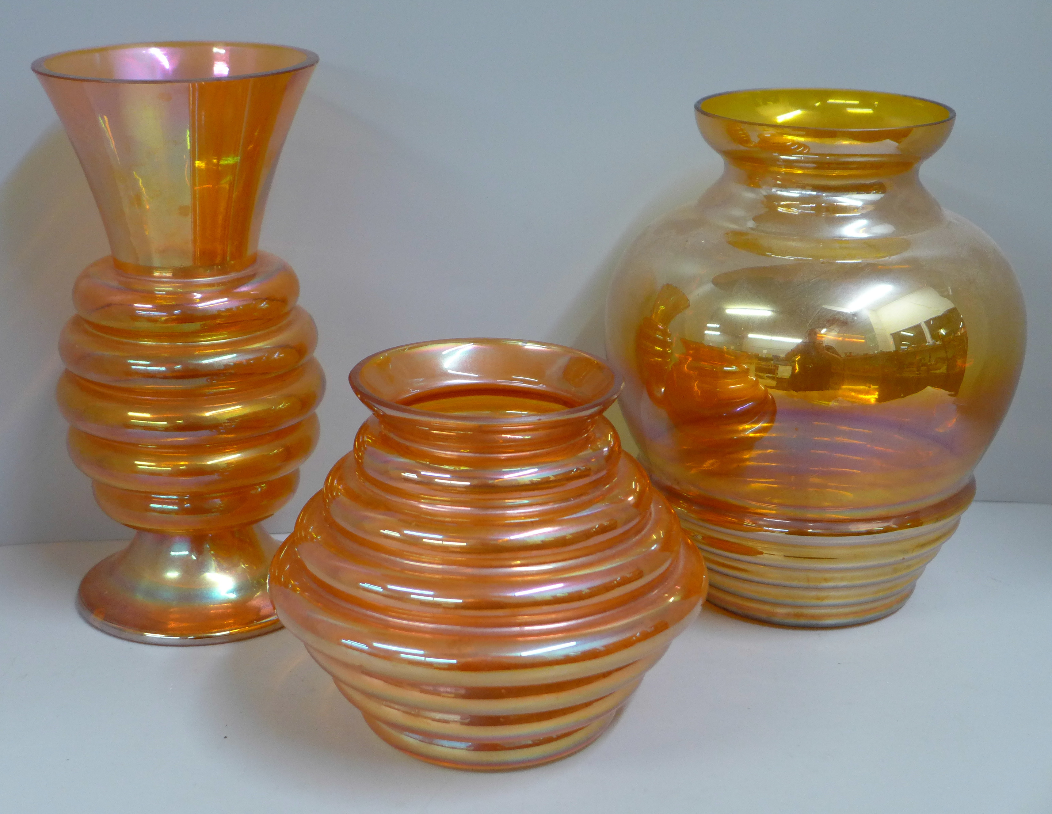 A Crown Crystal Australia melon rib glass vase in marigold, 24cm, one other 14cm and one in smoke