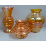 A Crown Crystal Australia melon rib glass vase in marigold, 24cm, one other 14cm and one in smoke