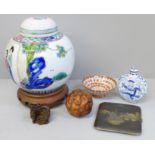 Six oriental items including two netsukes, ginger jar and cigarette case