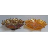Two carnival glass Dragon and Lotus bowls, marigold and smoky brown, possibly Butler Brothers