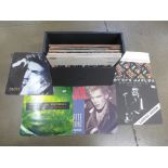 A record case of thirty 12" 45rpm records including Queen, Billy Idol, George Michael, Yazoo,