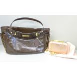 A Coach patent handbag in brown, with pink satin lining, top zip fastening and a variety of