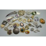 A collection of costume brooches