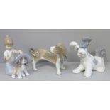 Two Lladro figures of dogs, one a/f and one figure of a girl playing with a dog