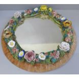 A Derby porcelain encrusted mirror, retail label to back