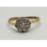 An 18ct gold and platinum diamond cluster ring, 2.6g, T