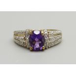 A 9ct gold, amethyst and twenty stone diamond ring, 2.7g, N