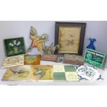 A collection of fireplace tiles, a model brass racehorse with jockey, a duck wall plaque, an