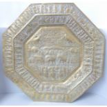 An Indian embossed octagonal brass plaque, 59cm