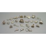 Twenty-five silver and white metal charms, all stamped or test as silver, 68g