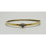 A silver gilt and tanzanite bangle