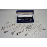Six silver pendants and chains and seven pairs of silver earrings