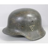 A German WWII period helmet with liner