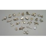 Twenty-five silver and white metal charms, all stamped or test as silver, 72g