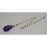 An Edwardian 10k gold mounted carved amethyst necklace