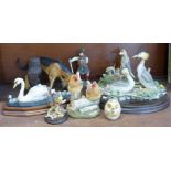 A collection of animal figure groups and a stoneware goblet, some figures a/f