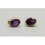 A pair of 18ct gold and amethyst earrings, 2.3g