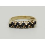 A 9ct gold and two row sapphire ring, 2.5g, N