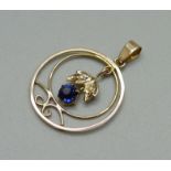 An Edwardian 9ct gold, blue stone and pearl pendant
