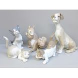 A Lladro squirrel, three cats and a dog