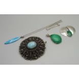 A silver and malachite pendant, a turquoise and silver pendant on chain, a malachite pendant (