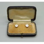 A cased pair of 9ct gold and mother of pearl studs