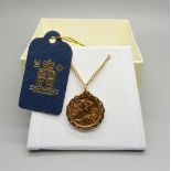 A 2001 gold proof sovereign mounted in 9ct gold pendant mount on a 9ct gold chain, total weight 16.