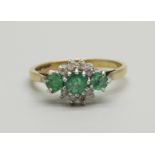 A 9ct gold, emerald and diamond cluster ring, 2.1g, N