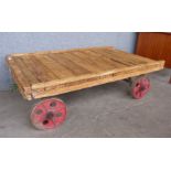 An industrial pine flatbed trolley