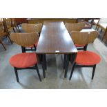 A G-Plan Librenza tola wood and black drop leaf table and four butterfly-back chairs