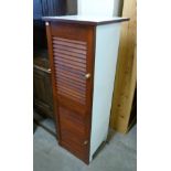 A painted mahogany two door cupboard