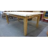 A large 19th Century and later pine two drawer farmhouse kitchen table