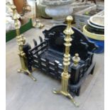 A cast iron fire grate and a pair of andirons