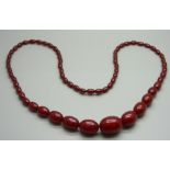 A cherry Bakelite graduated bead necklace, 90cm approximate length, largest bead 30mm, 86g