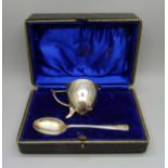 A silver egg cup and spoon set, with inscription, 58g