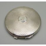 A silver compact, 77g