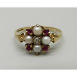 A 9ct gold, garnet, pearl and diamond cluster ring, 2.1g, O