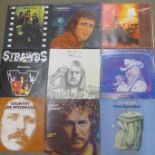 Twelve 1970s LP records, Yes, Steely Dan, Eric Clapton, etc.