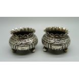 A pair of embossed silver salts, Birmingham 1891, 64g