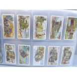 Cigarette cards; an album containing ten complete sets of Wills cigarette cards, including