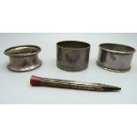 Three silver napkin rings and a silver propelling pencil, 65g