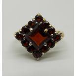 A silver gilt and garnet cluster ring, P