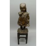Juan Clara, 1875-1957, a bronze statue of a girl standing on a stool, foundry mark to base of