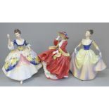 Three Royal Doulton figures; Christine, Lisa, Top o' The Hill and a wooden base, Top o' The Hill
