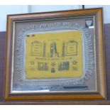 A framed WWII seat cushion, Forward Allies, Souvenir of Tripoli, 23-1-43, other badges including