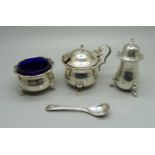 A three piece silver cruet set, Birmingham 1926 and a silver salt spoon, 105g