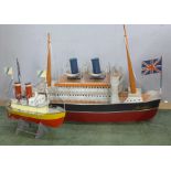 Two models of tin plate steam boats