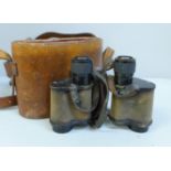A pair of Ross London binoculars in a leather case, early 20th Century