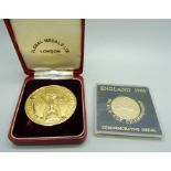 A 1966 World Cup gold plated commemorative medal (Global Medals Ltd., London), boxed and a 1966